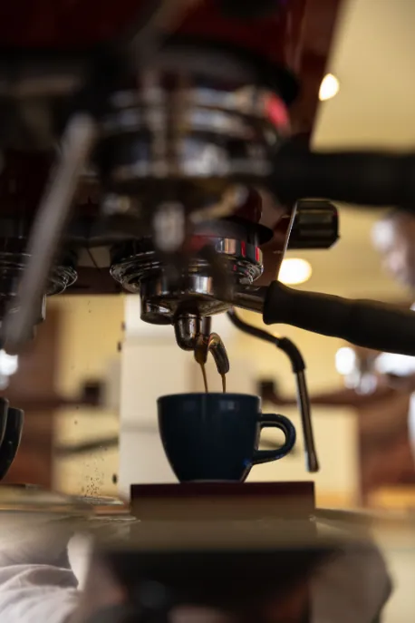 Espresso pouring into a cup during a coffee demonstration